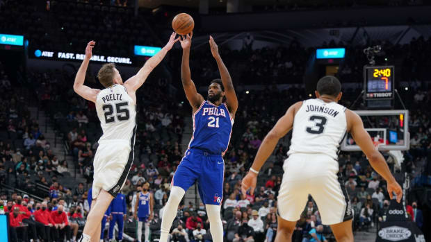 Jan 23, 2022; San Antonio, Texas, USA; Philadelphia 76ers center Joel Embiid (21) shoots over San Antonio Spurs center Jakob Poeltl (25) in the second half at the AT&amp;T Center. Mandatory Credit: Daniel Dunn-USA TODAY Sports